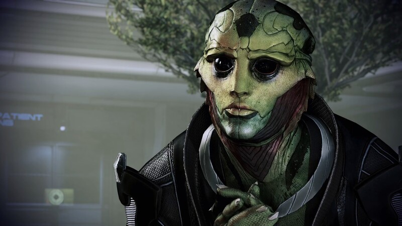 Thane Krios sitting in his room looking at you