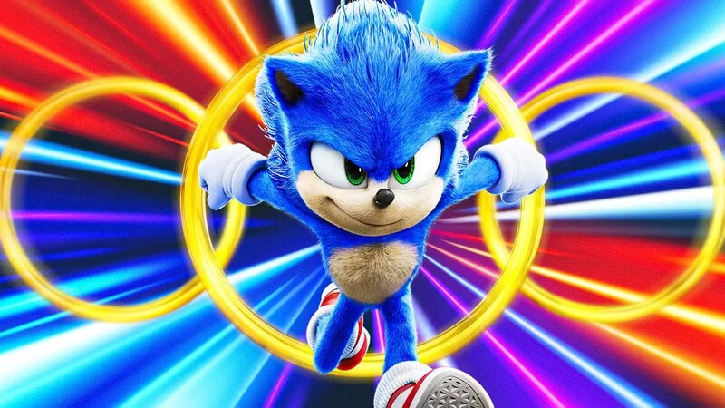 Sonic running through rings with a colorful background that makes it look like hes running fast