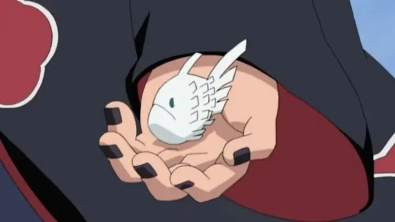 Deidara holding one of his exploding clay fish in his hand