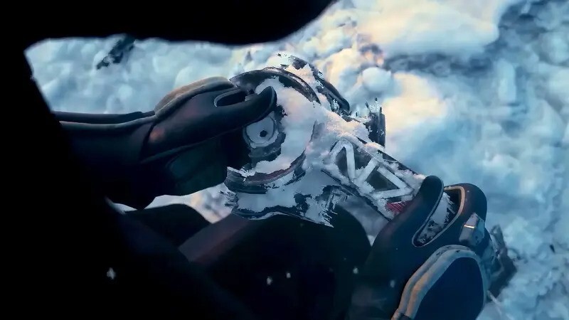 An Asari Alien known as Liara looking at a piece of N7 armor in the snow