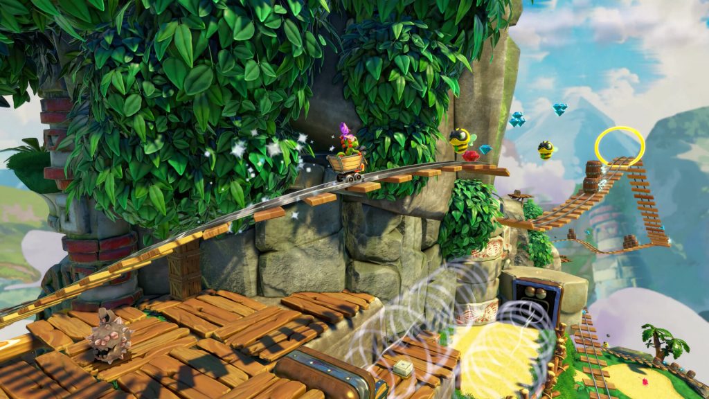 Yooka and Laylee riding their buddy Kartos in one of this many levels. These levels are inspired by the iconic minecart stages from DKC.