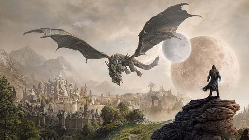 Person standing on a rock staring at a dragon flying