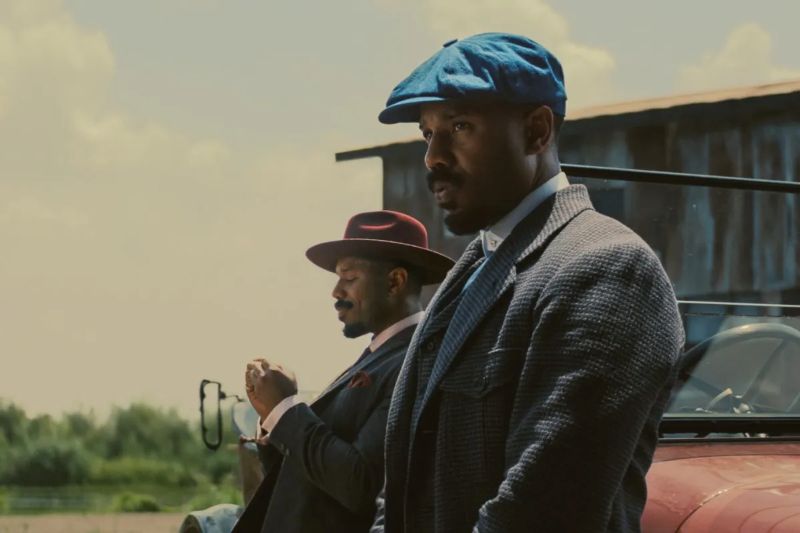 Sinners up close shot of Michael B Jordan in blue and red hats
