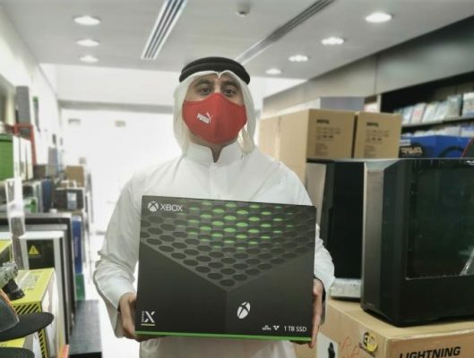 Man Wearing Traditional Clothes in Bahrain Buying Xbox Series X