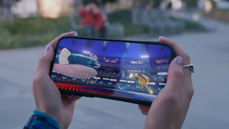 Someone hands playing Pokémon Champions on their smart phone