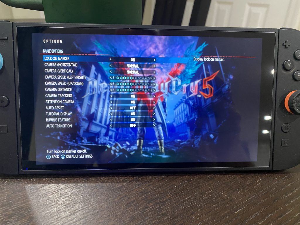 The overall Game Options for DMC V on Switch 2, including camera options and the ability to turn on 'Auto-Assist' for pulling off advanced combos and attacks.