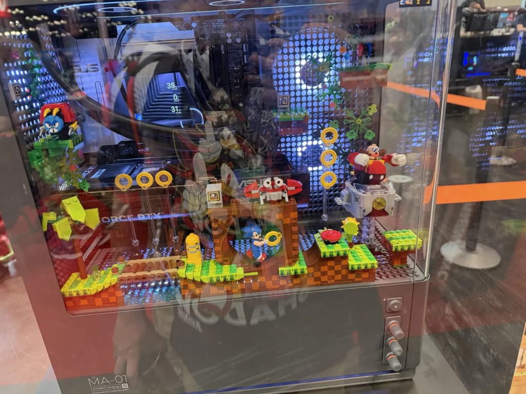 One of the coolest things I saw at AnimeNYC were PC cases that let you use LEGO's to deck-out the side of them.